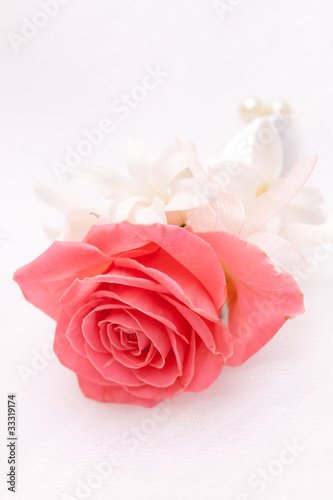boutonniere of pink roses