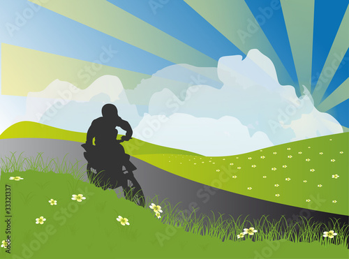 man on motorcycle in rural landscape