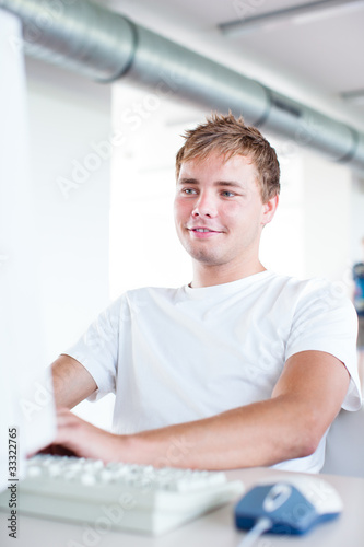 handsome college student using a computer