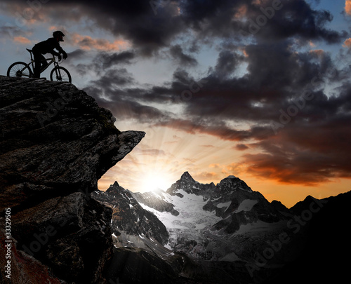 silhouette of a biker in the Swiss Alps