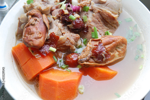 image of carrot soup with pork meat photo