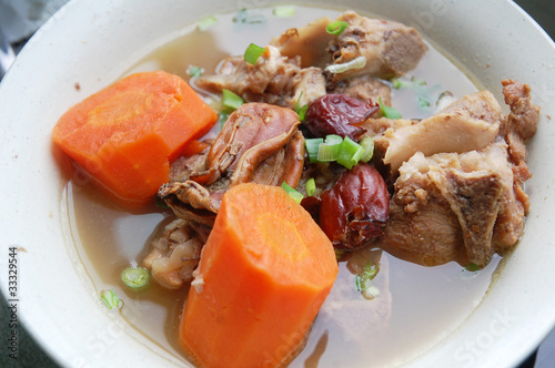 image of carrot soup with pork meat photo