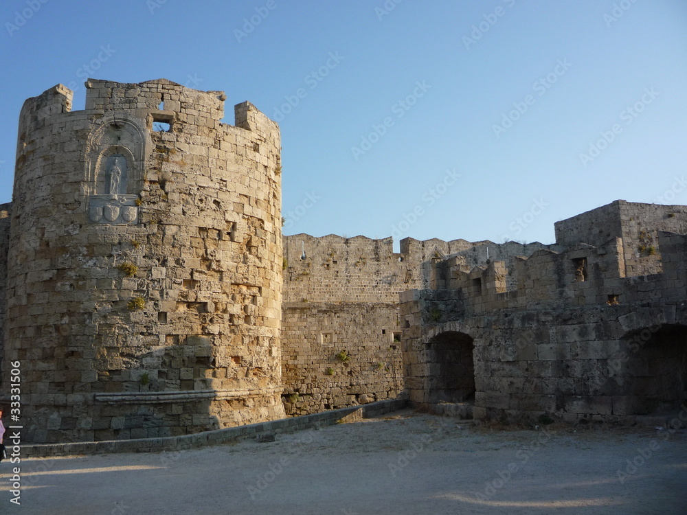 Rhodes castle in greece with stone walls and turret Rhodes castle in greece with stone walls and turret