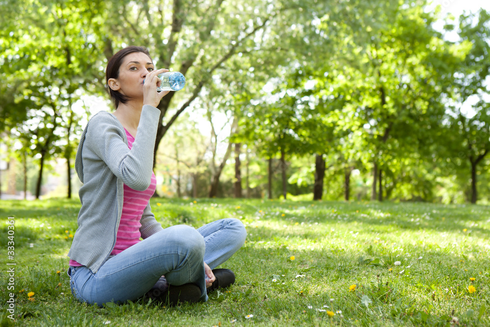 thirsty woman with bottle of water thirsty woman with bottle of water
