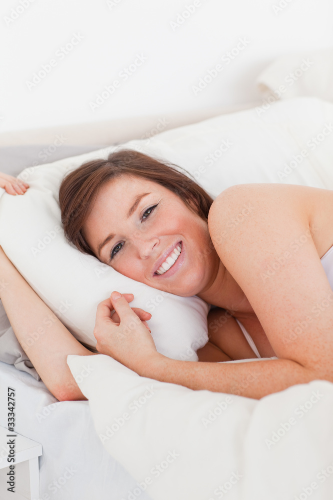 Attractive brunette woman posing while lying Attractive brunette woman posing while lying