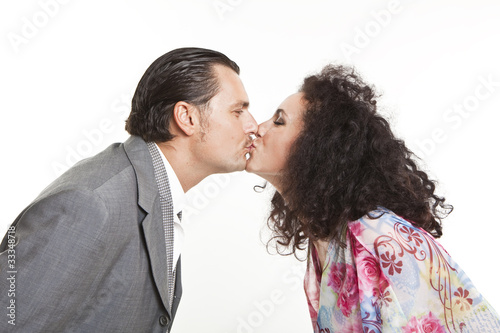 confident elegant couple of young people kissing