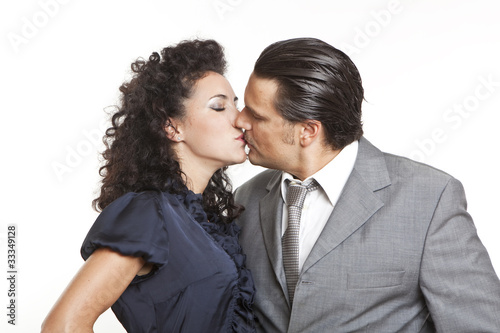 confident elegant couple of young people kissing