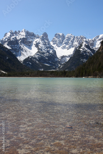 large mountain lake with snowed mountains, italy dolomites.