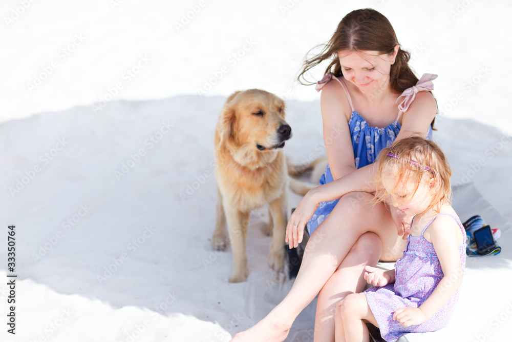 Mother, daughter and dog