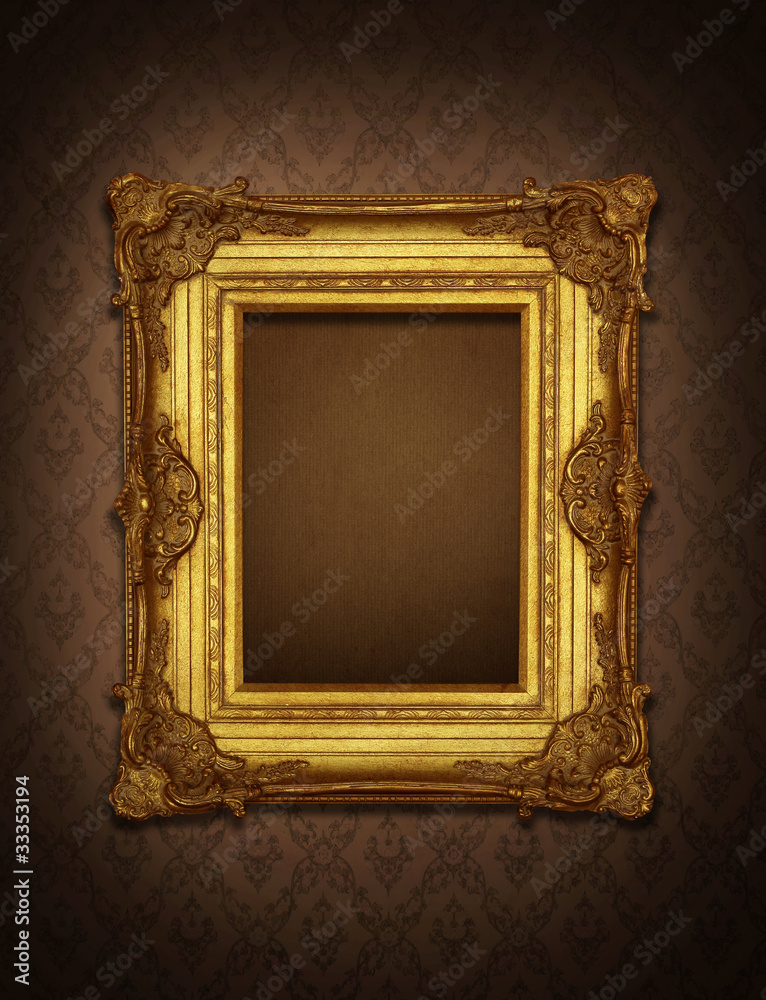 Gold frame stuck on the wall wallpaper thai the dark. Stock Photo