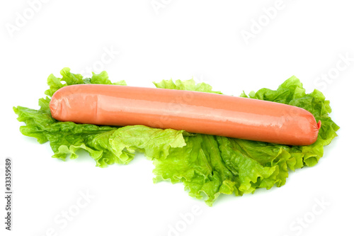 Sausage arranged with lettuce isolated on white background