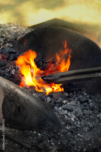 Blacksmith heating up iron - detail
