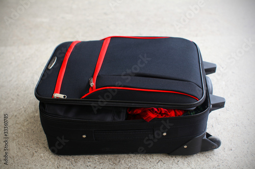 Open suit case luggage at the airpot, lost