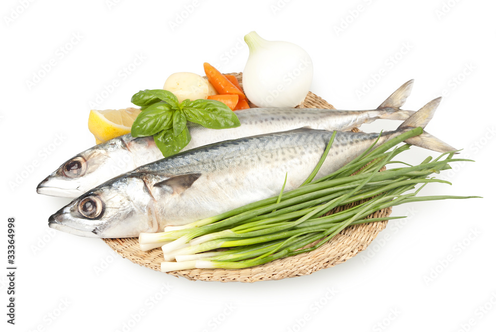 fresh sardines on a plate with vegetables fresh sardines on a plate with vegetables