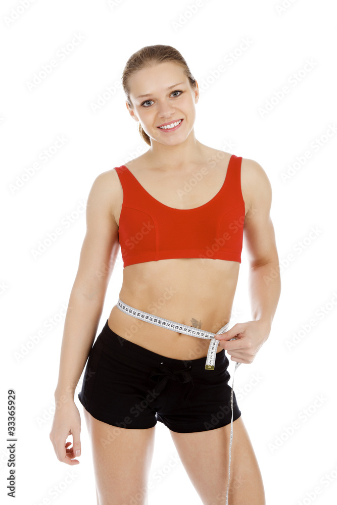 Sport woman with measuring tape posing against white background Sport woman with measuring tape posing against white background
