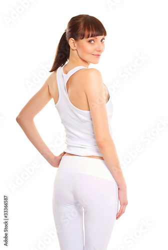 Back of a young and sexy brunette in white sporty clothes