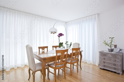 modern dining room with white curtains