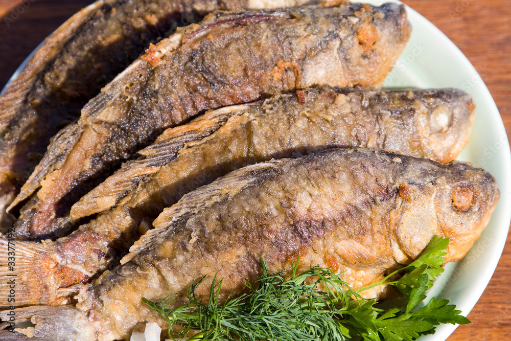 Fried fish carp in plate Fried fish carp in plate