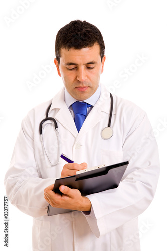 Portrait of a young medical doctor with stethoscope writing. Iso