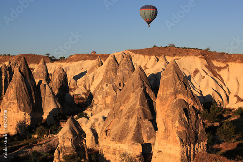 Balloons over Cappadocia valleys on dawn