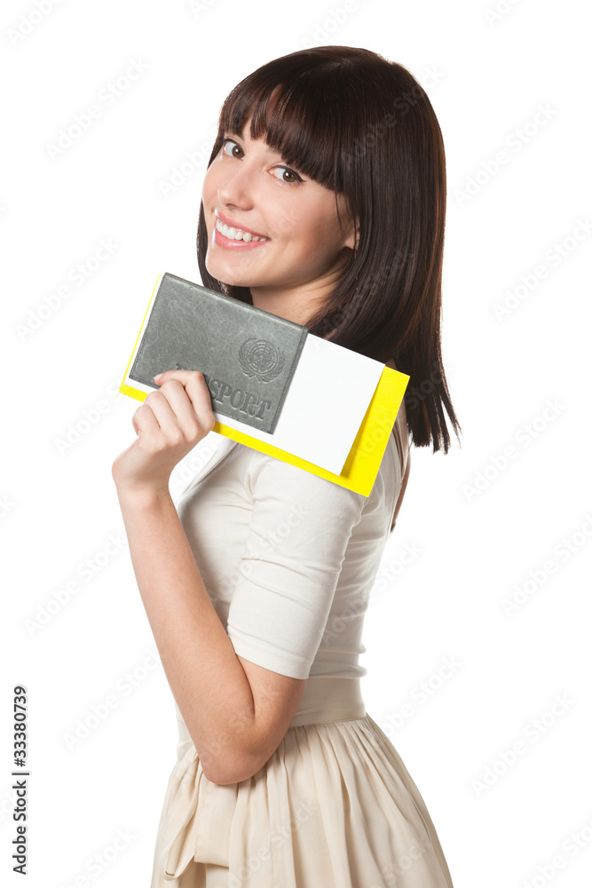 Portrait of young female holding her passport and tickets Portrait of young female holding her passport and tickets