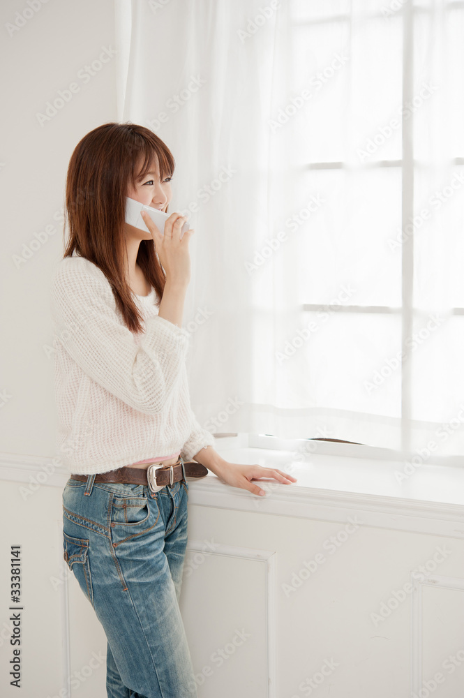 beautiful asian woman talking by cellphone beautiful asian woman talking by cellphone