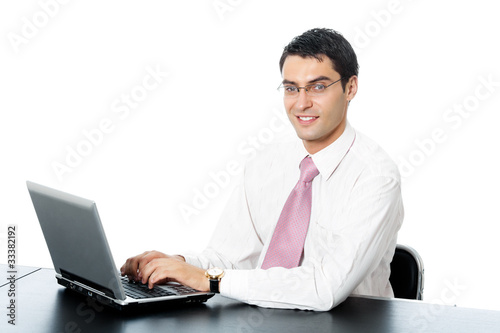 Businessman in glasses working with laptop, isolated on white