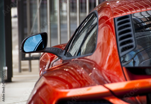 Tableau sur toile Detail of an orange sports car
