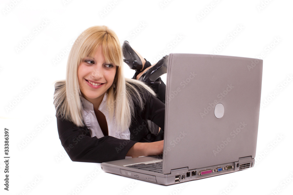 young woman lying and looking at laptop young woman lying and looking at laptop