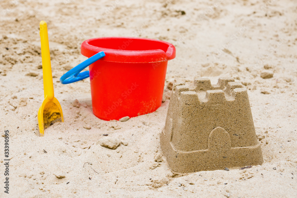 Sandcastle with bucket and shovel Sandcastle with bucket and shovel