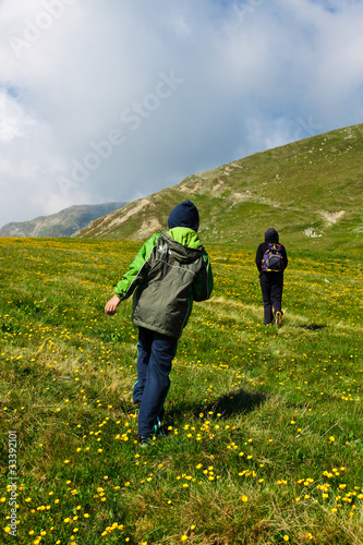 Tourists hiking on Iezer peak in Parang mountains