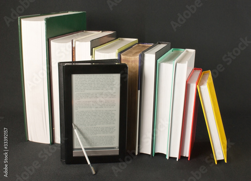 Obraz na płótnie Row of printed books with electronic book reader w salonie