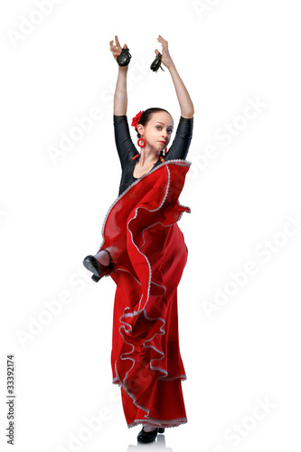 Billede på lærred young woman dancing flamenco with castanets isolated on white