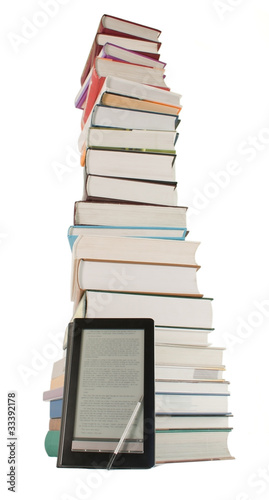 Obraz na płótnie Tall stack of books and e-book reader on the white background w salonie