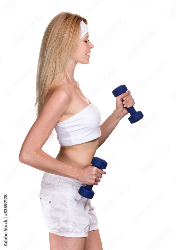 Portrait of a smiling sporty woman with a dumbbell on white back Portrait of a smiling sporty woman with a dumbbell on white back
