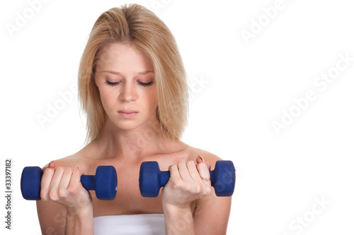 Portrait of a sporty woman with a dumbbell on white background