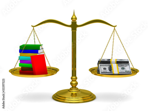 Books and money on scales. ...