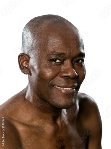 Close-up portrait of shirtless smiling man