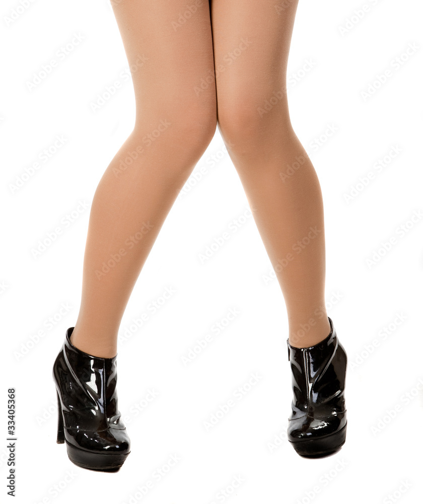 beautiful woman legs in black shoes on white beautiful woman legs in black shoes on white