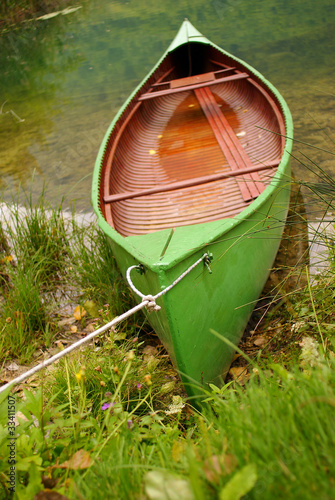 Bild auf Leinwand green boat and lake