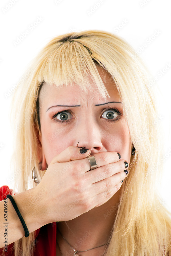 Scared girl covers her mouth