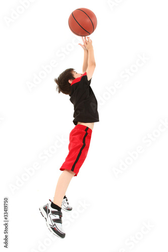 Energetic Boy Child Jumping with Basketball
