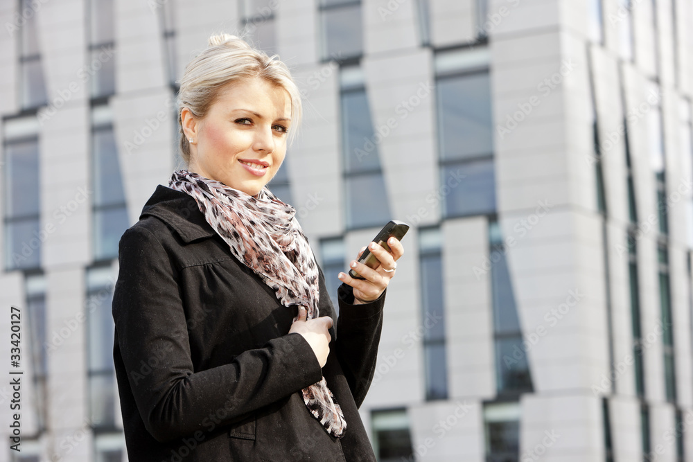 portrait of young businesswoman with a mobile portrait of young businesswoman with a mobile
