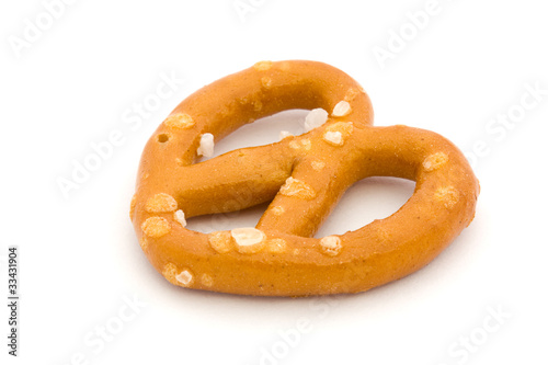 Single salted pretzel on white