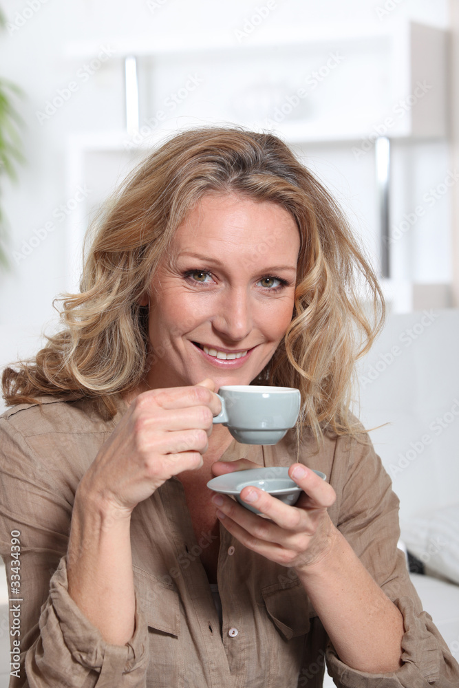 Woman drinking an expresso Woman drinking an expresso