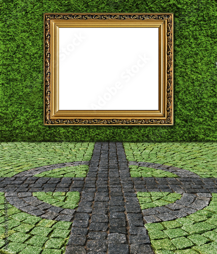 elegant golden frame on green painted stone wall rough backgroun photo