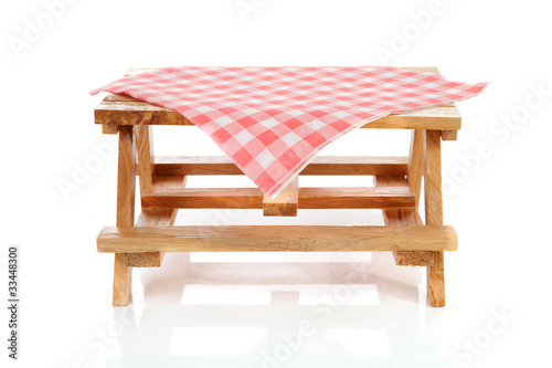 empty picnic table with tablecloth