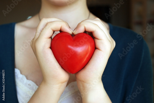 Fototapeta Naklejka Na Ścianę i Meble -  woman hands hold heart