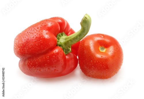 Tomato and pepper on white background