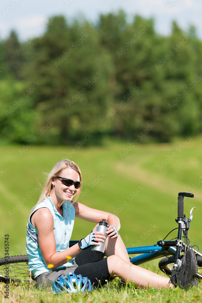 Fototapeta premium Sport mountain biking girl relax in meadows